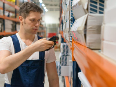 Supervisor scanning package barcode at the warehouse.